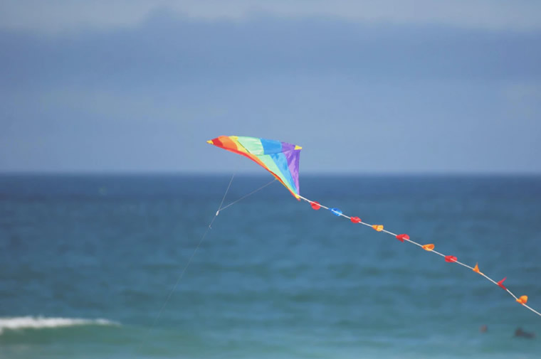 kite flying over water