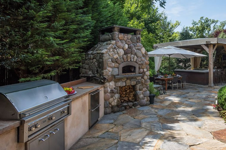 stone chimney outdoor kitchen